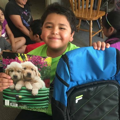 boy with school supplies