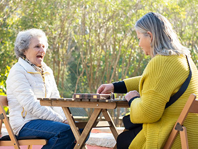 Two adults women chatting