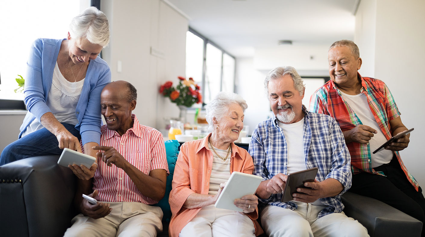 Group of senior playing with gadgets