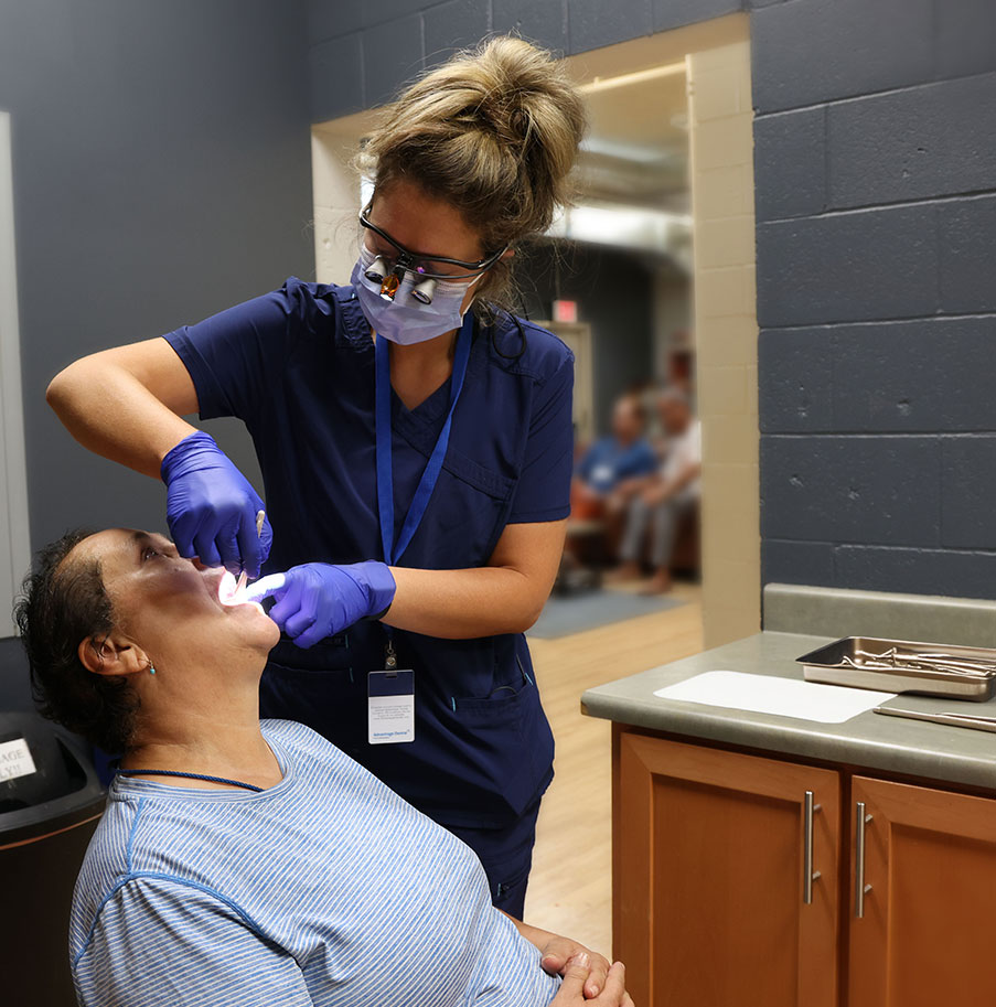 Dentist examining a resident