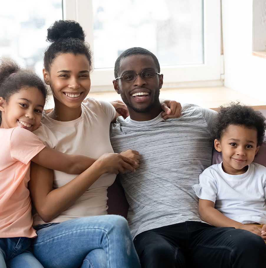 Happy family sitting in a couch