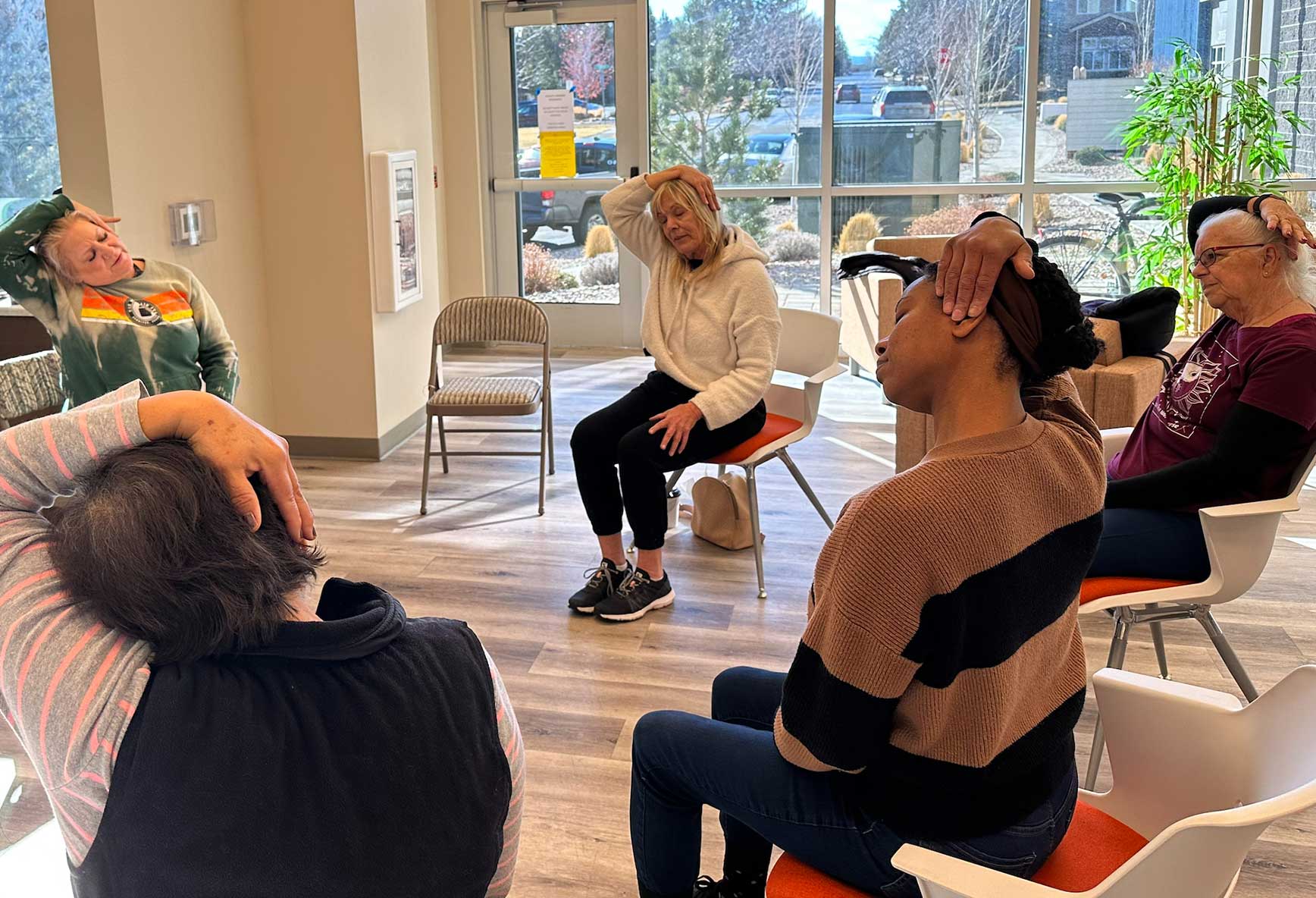 Residents doing chair yoga