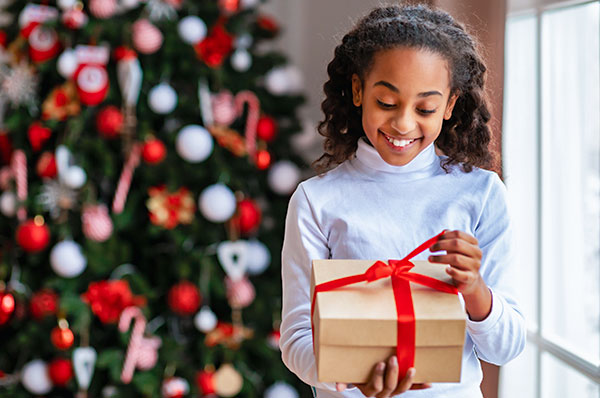 A girl opening present