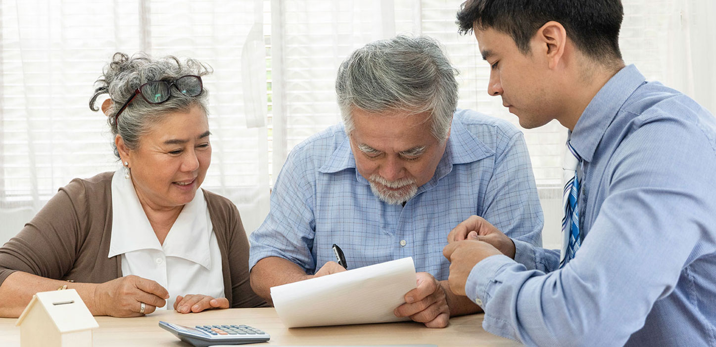Young social worker assisting couple
