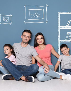 Family of 4 sitting on the floor